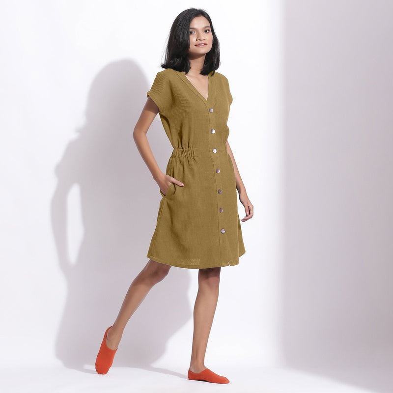Right View of a Model wearing Cotton Waffle Olive Green Button-Down Dress