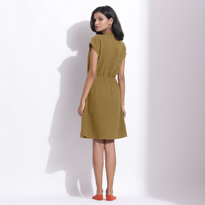 Back View of a Model wearing Cotton Waffle Olive Green Button-Down Dress