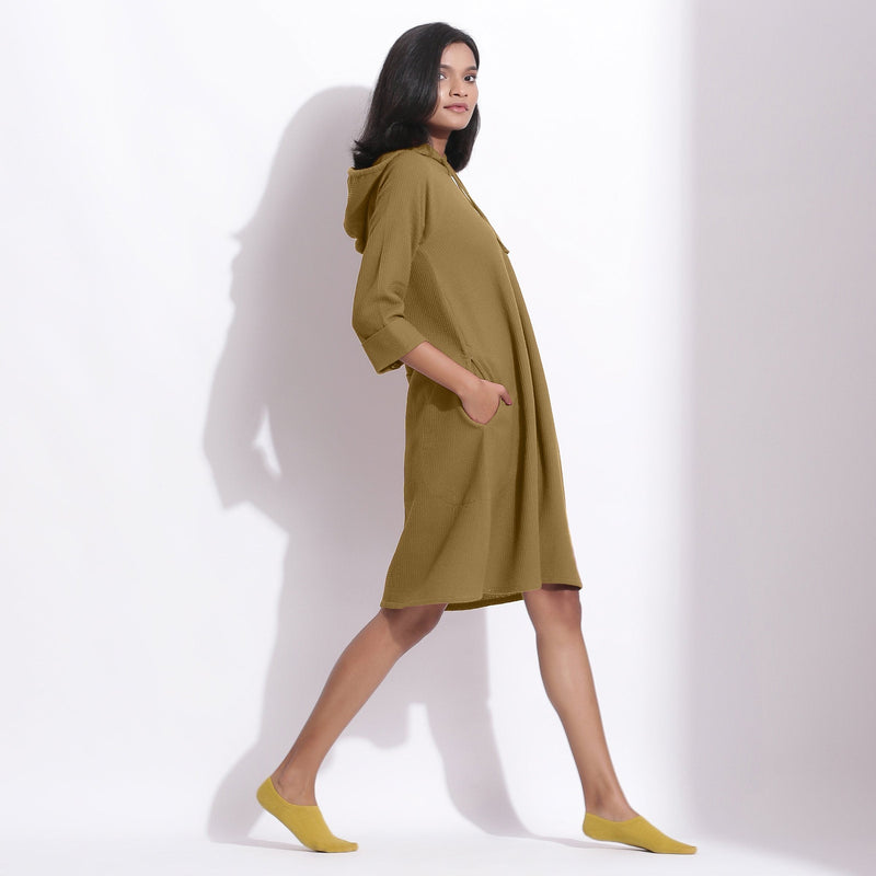 Right View of a Model wearing Cotton Waffle Olive Green Hoodie Dress