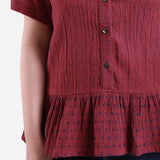 Front Detail of a Model wearing Crimson Crinkled Cotton Polka Dot Peplum Top