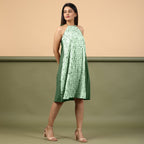 Right View of a Model wearing Dark Green Green Shibori Halter Neck A line Dress