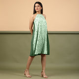 Right View of a Model wearing Dark Green Green Shibori Halter Neck A line Dress