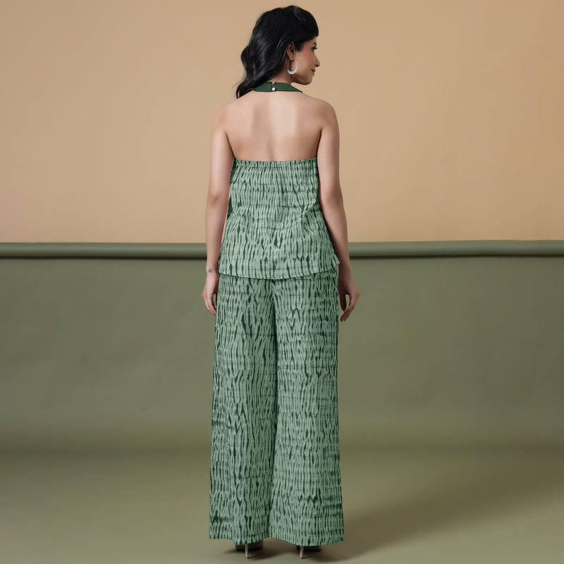 Back View of a Model wearing Dark Green Shibori Halter Neck Flared Top