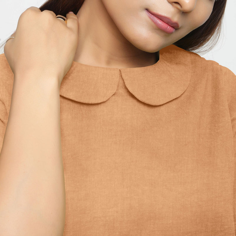 Front Detail of a Model wearing Desert Yellow 100% Linen Peter Pan Collar Top