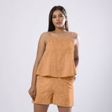 Front View of a Model wearing Desert Yellow 100% Linen Flared Camisole Top