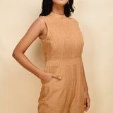 Front Detail of a Model wearing Desert Yellow 100% Linen Princess Line Sleeveless Jumpsuit