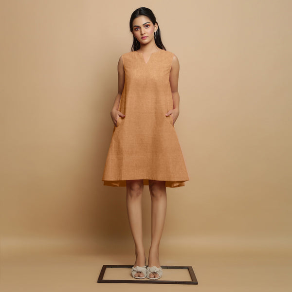 Front View of a Model wearing Desert Yellow Linen Embroidered Knee-Length Godet Dress