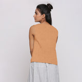 Back View of a Model wearing Desert Yellow Linen Split Neck Button-Down Sleeveless Top