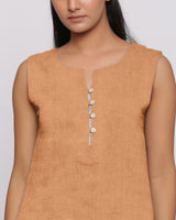 Front Detail of a Model wearing Desert Yellow Linen Split Neck Button-Down Sleeveless Top