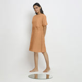 Left View of a Model wearing Desert Yellow Linen Knee Length Yoked Dress