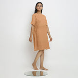 Right View of a Model wearing Desert Yellow Linen Knee Length Yoked Dress