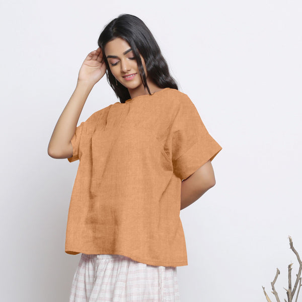Left View of a Model wearing Desert Yellow Round Neck Linen Yoked Top