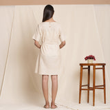 Back View of a Model wearing Dusk Beige Striped 100% Cotton Short Sack Dress