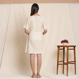 Back View of a Model wearing Dusk Beige Striped 100% Cotton Short Sack Dress