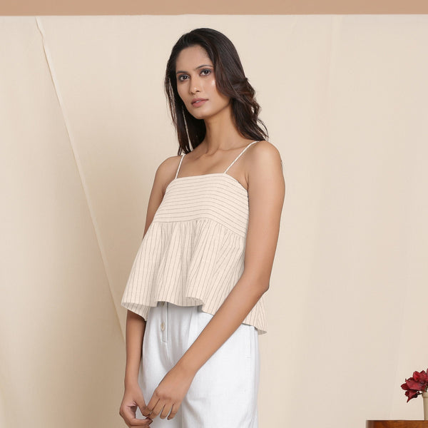 Left View of a Model wearing Dusk Beige Striped Cami Top