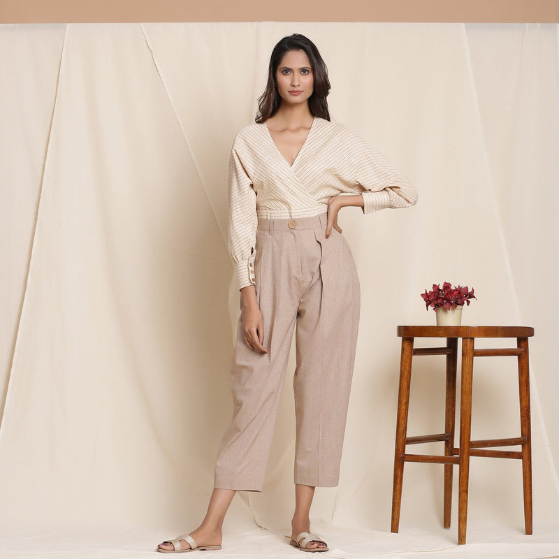 Front View of a Model wearing Dusk Brown Box Pleated Pegged Pant