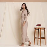 Left View of a Model wearing Dusk Brown Cotton Elasticated Surplice Neck Overalls Jumpsuit