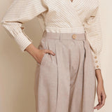 Front Detail of a Model wearing Dusk Brown Box Pleated Pegged Pant