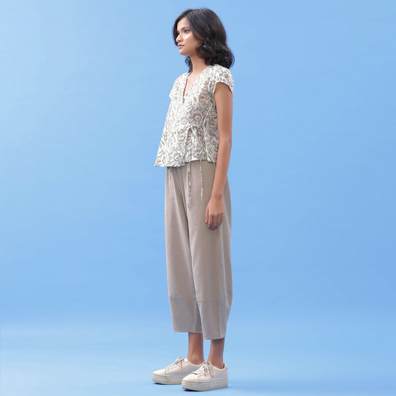 Left View of a Model wearing Essential Beige Cotton Paneled Pant