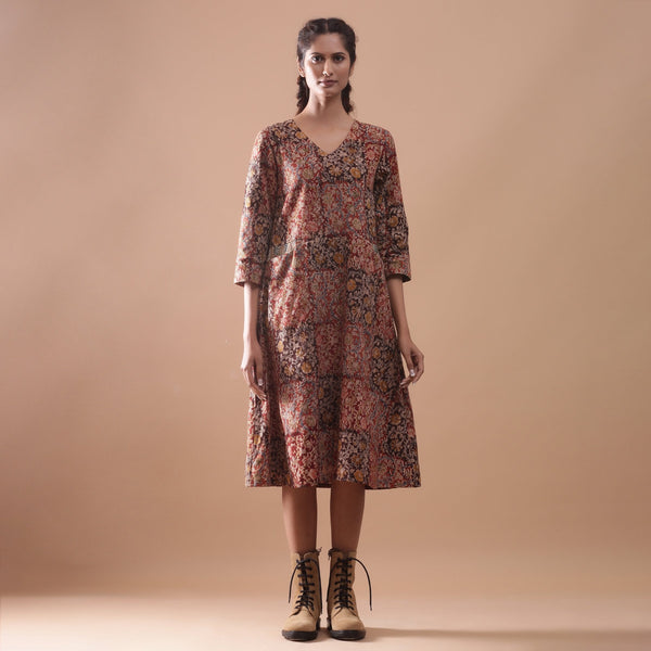 Front View of a Model wearing Warm Block Printed Muddy Red Cotton Midi Dress
