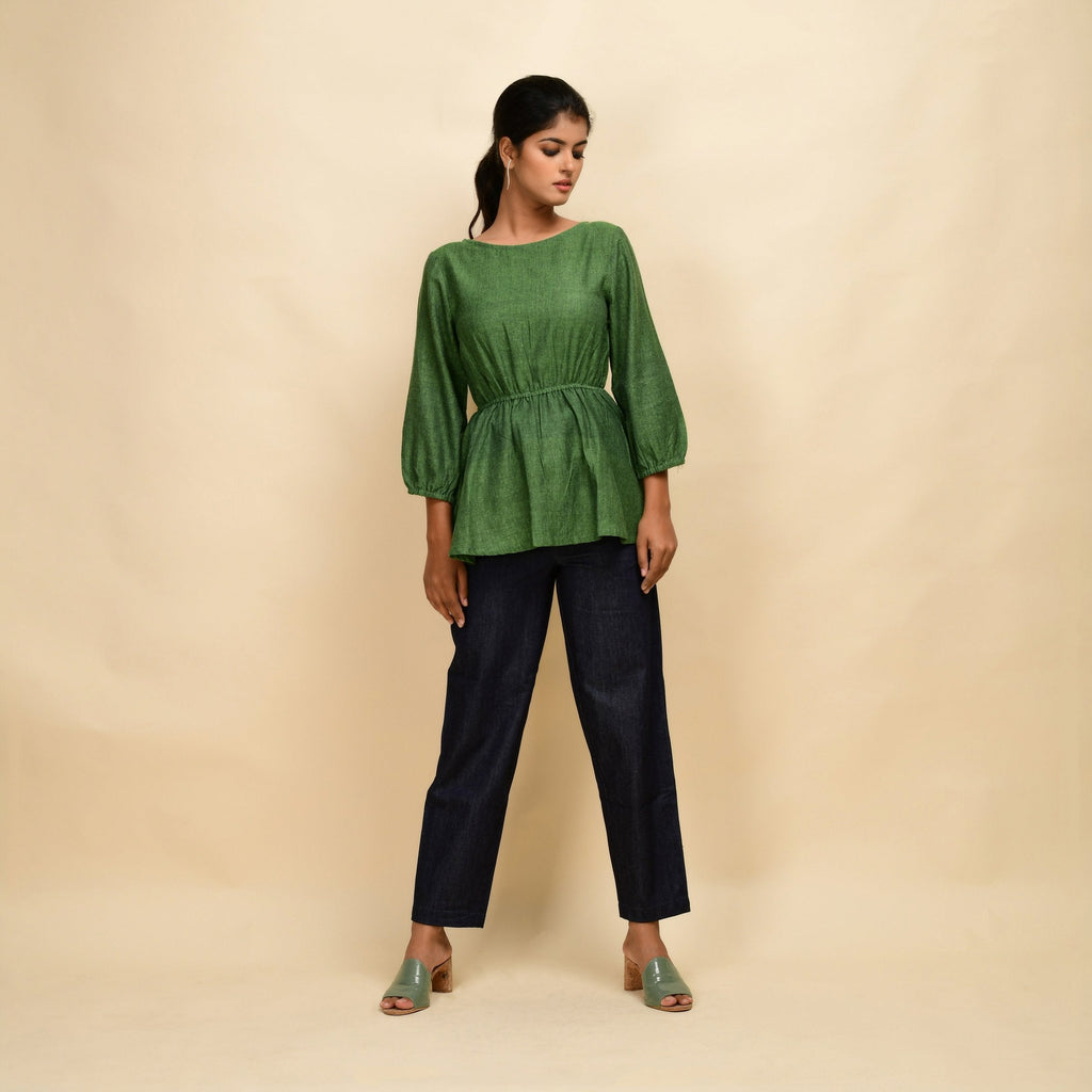 Front View of a Model wearing Forest Green Yarn Dyed Cotton Round Neck Peplum Top