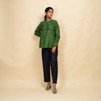 Front View of a Model wearing Forest Green Handspun 100% Cotton Yoked Top