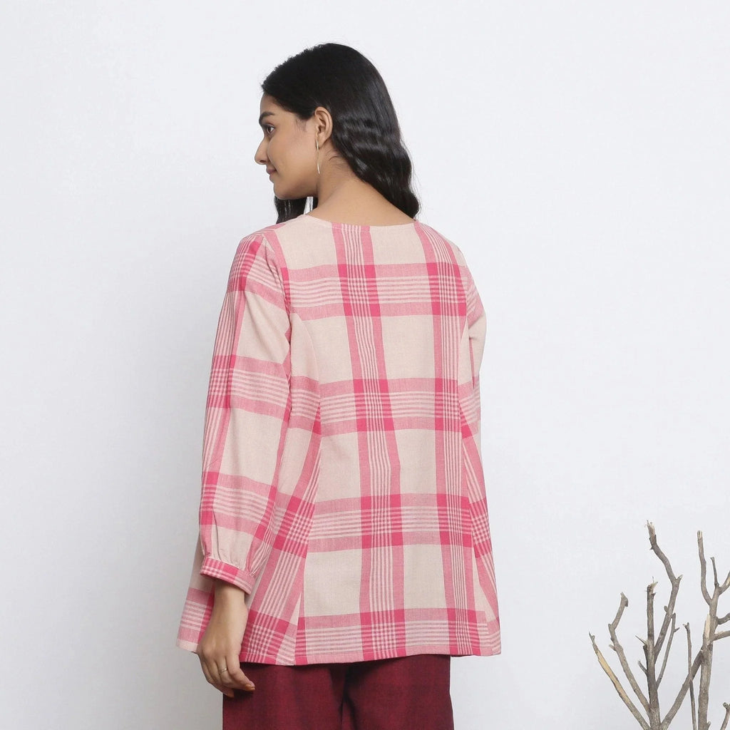 Back View of a Model wearing Fuchsia and Pink Checkered Flared Top