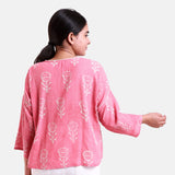 Back View of a Model wearing Fuchsia Dabu Printed V-Neck Floral Top