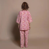 Back View of a Model wearing Fuchsia Floral Block Printed Cotton Tunic Top