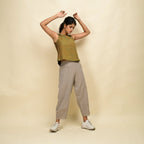 Right View of a Model wearing Gold Green Handspun Cotton Sleeveless Top