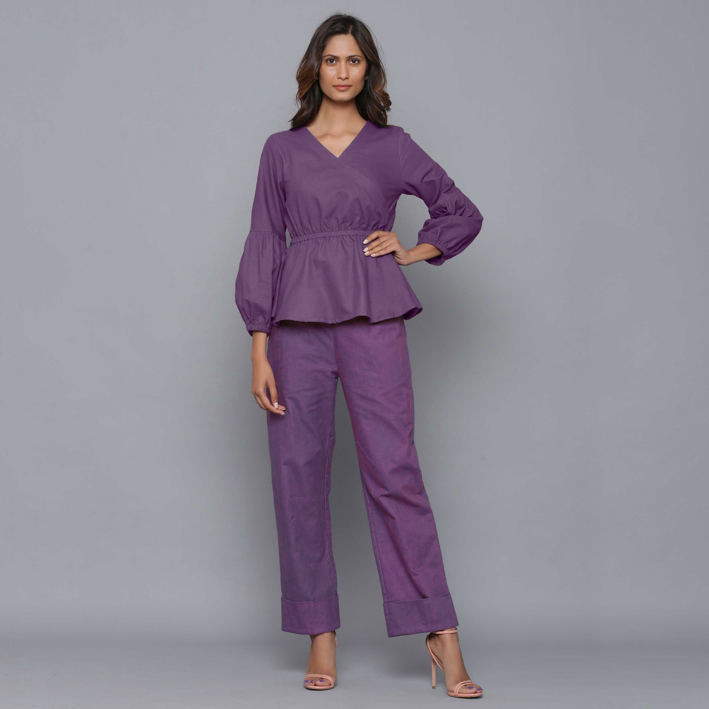 Front View of a Model wearing Grape Wine V-Neck Flannel Peplum Top