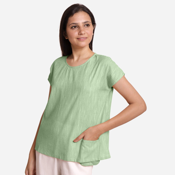 Left View of a Model wearing Green 100% Cotton Boat Neck A-Line Top