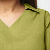 Front Detail of a Model wearing Green Bracelet Sleeve Straight Top