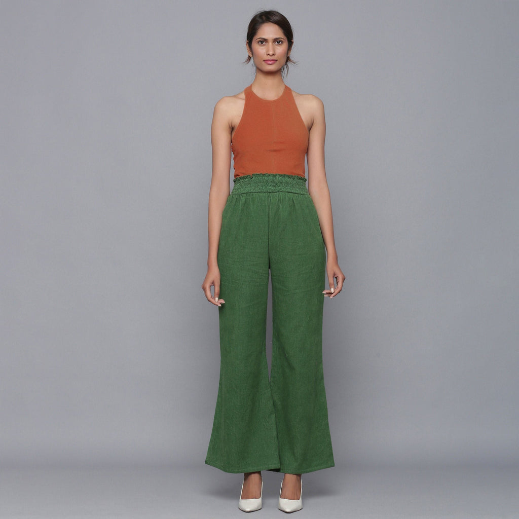 Front View of a Model wearing Green Corduroy Striped Bootcut Pant