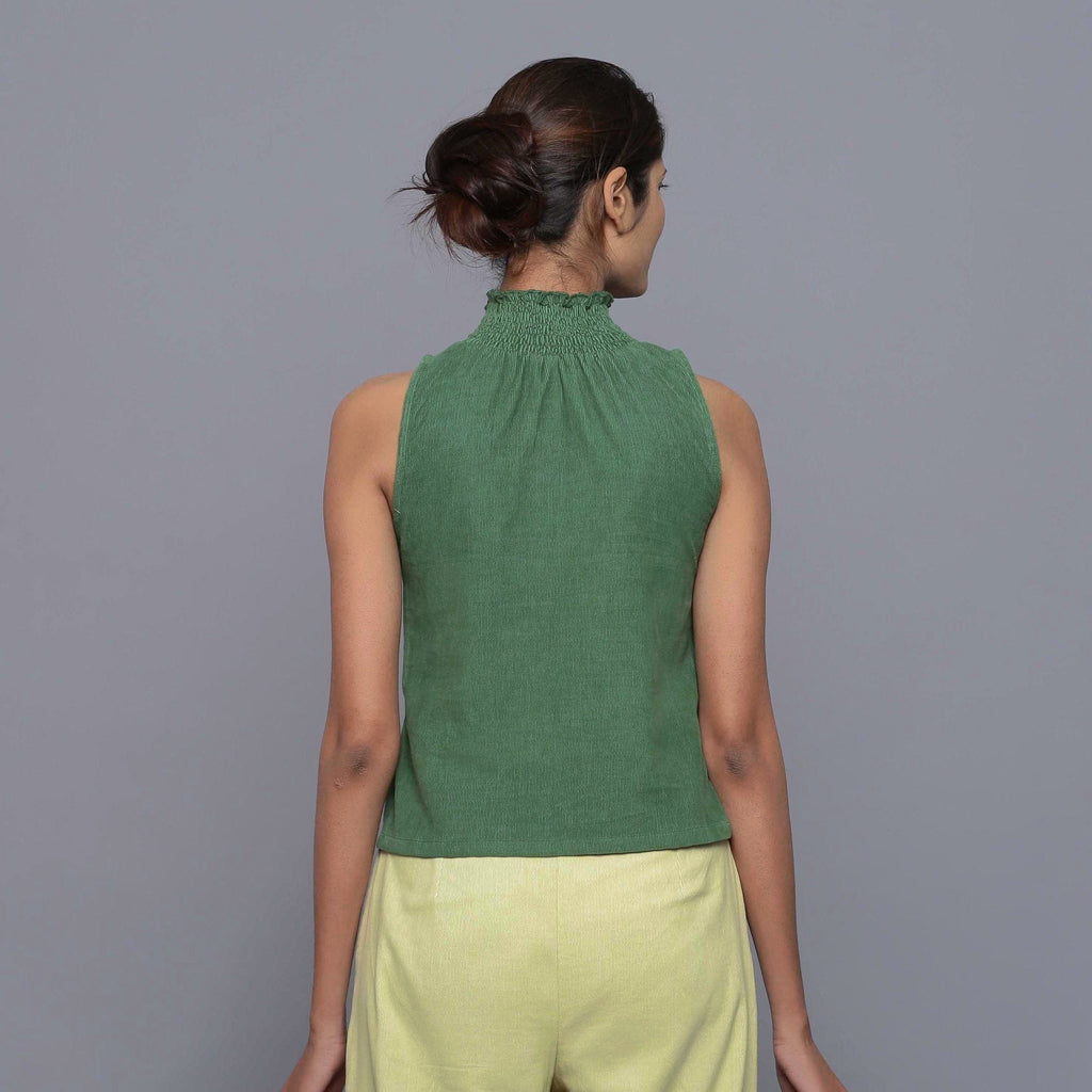 Back View of a Model wearing Green Cotton Corduroy High Neck Top