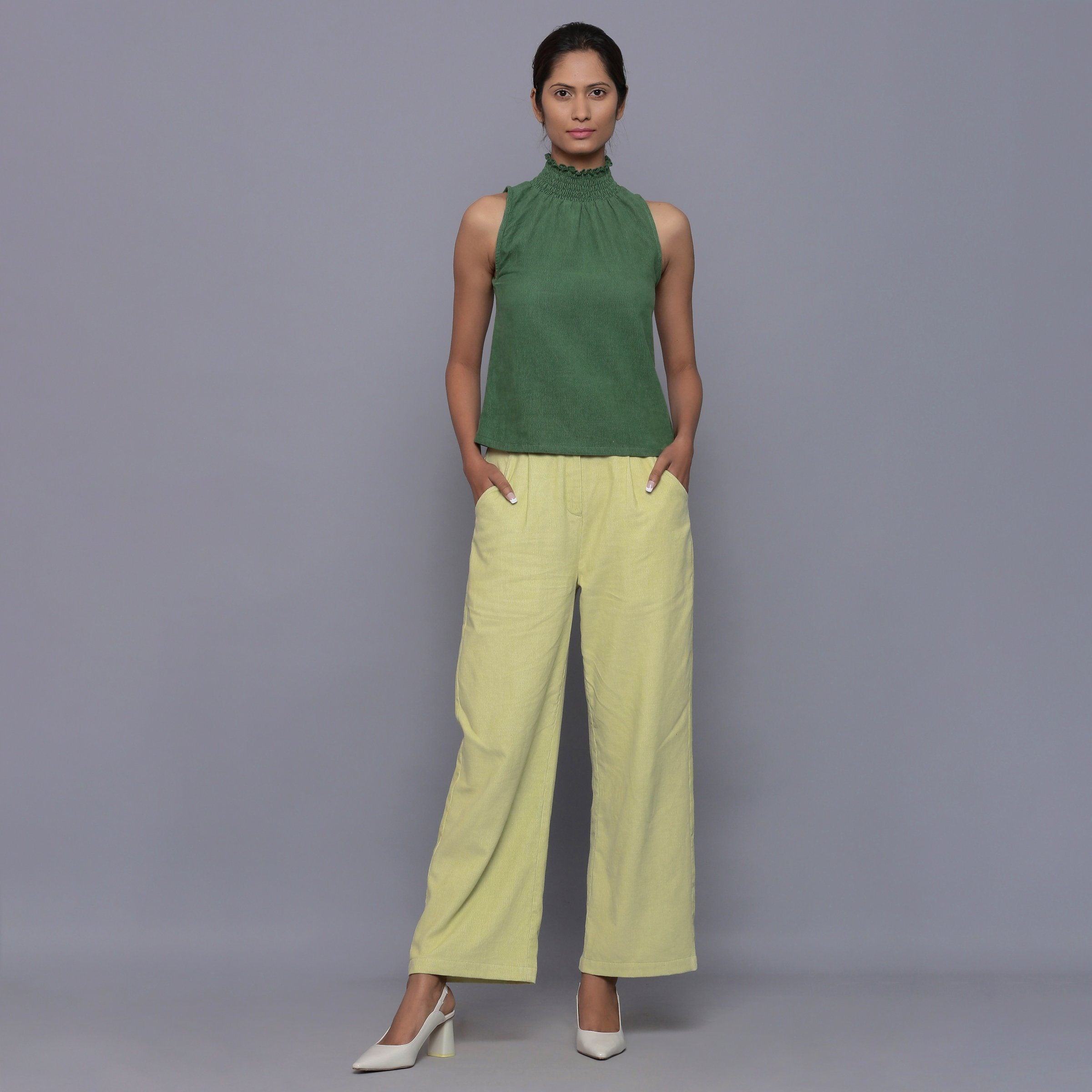 Front View of a Model wearing Green Cotton Corduroy High Neck Top