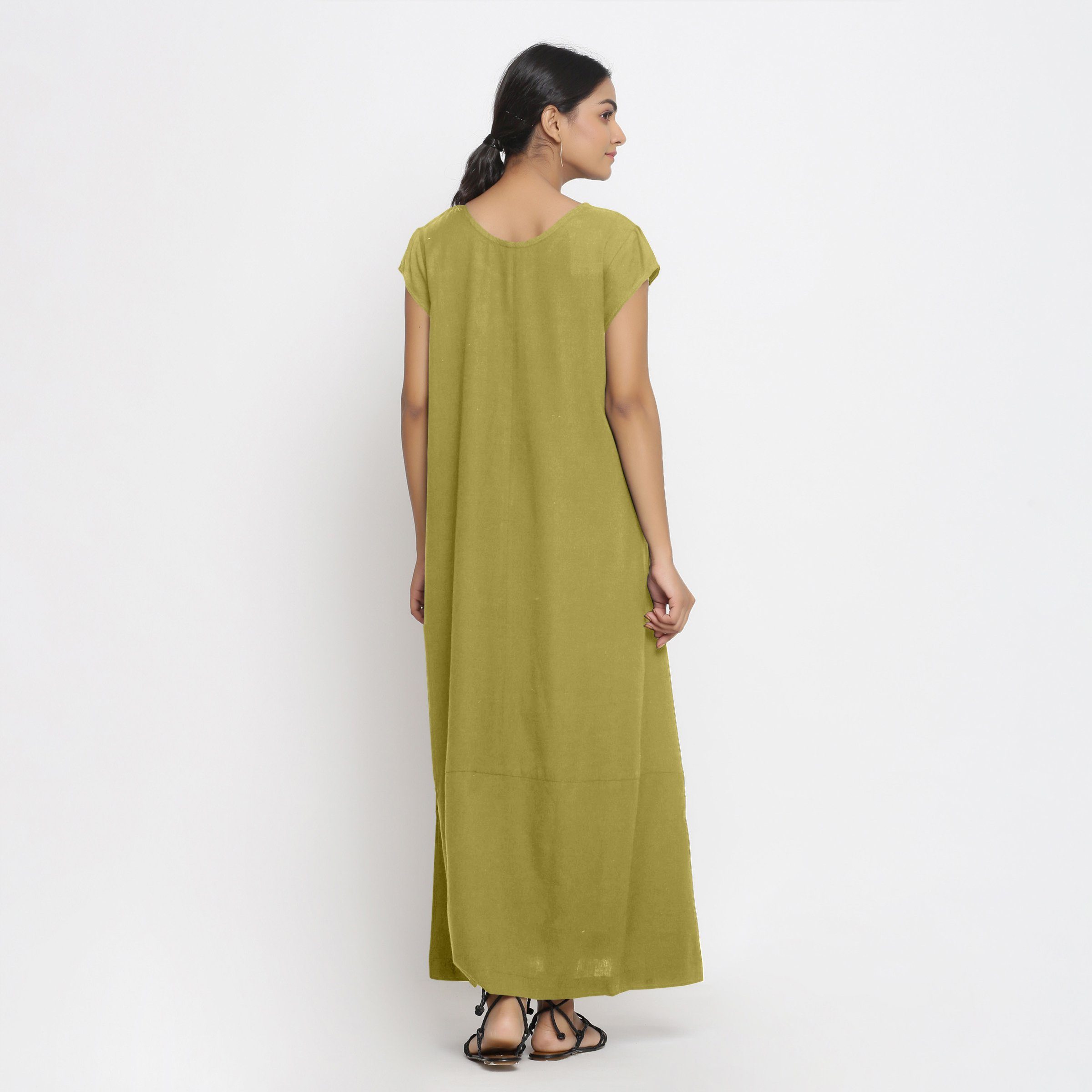 Back View of a Model wearing Green Cotton Flax A-Line Paneled Dress