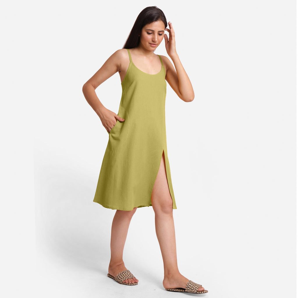 Right View of a Model wearing Green Cotton Flax Strappy Slit Dress