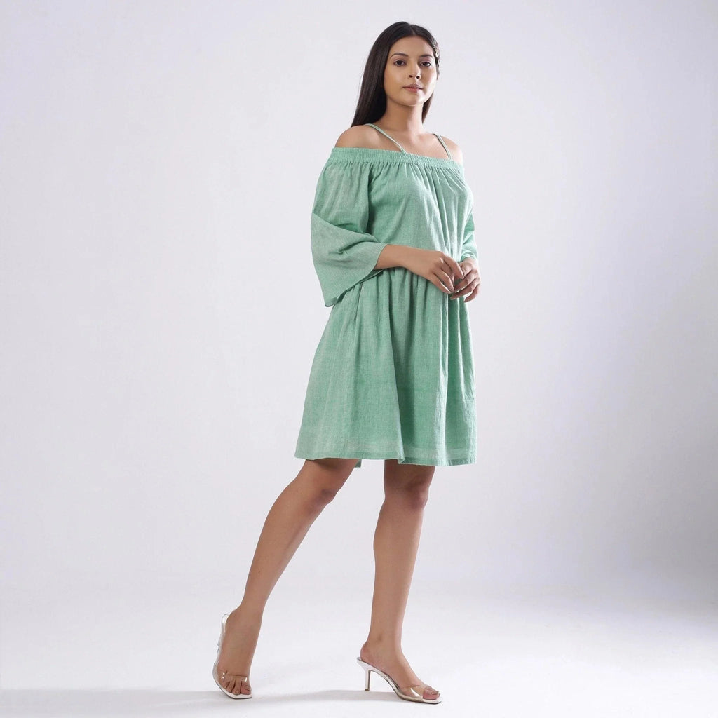Right View of a Model wearing Green Off-Shoulder Fit and Flare Dress