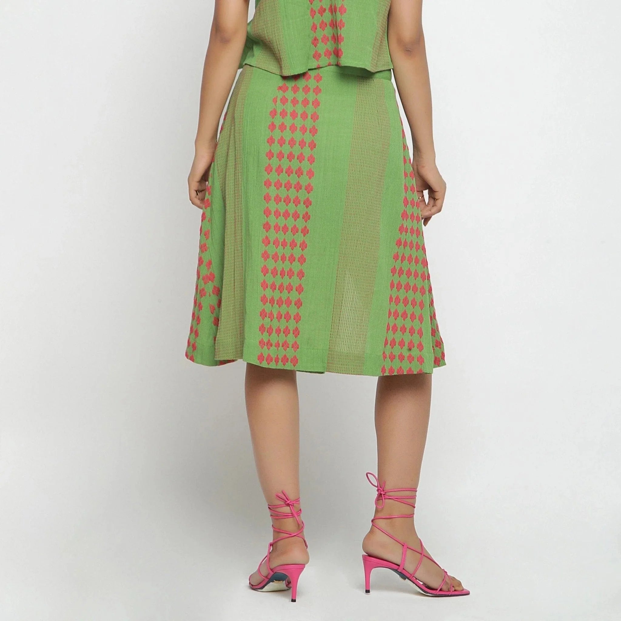 Back View of a Model wearing Green Crinkled Cotton Geometric Knee Length Skirt