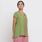 Right View of a Model wearing Green And Red Yarn Dyed A-Line Top