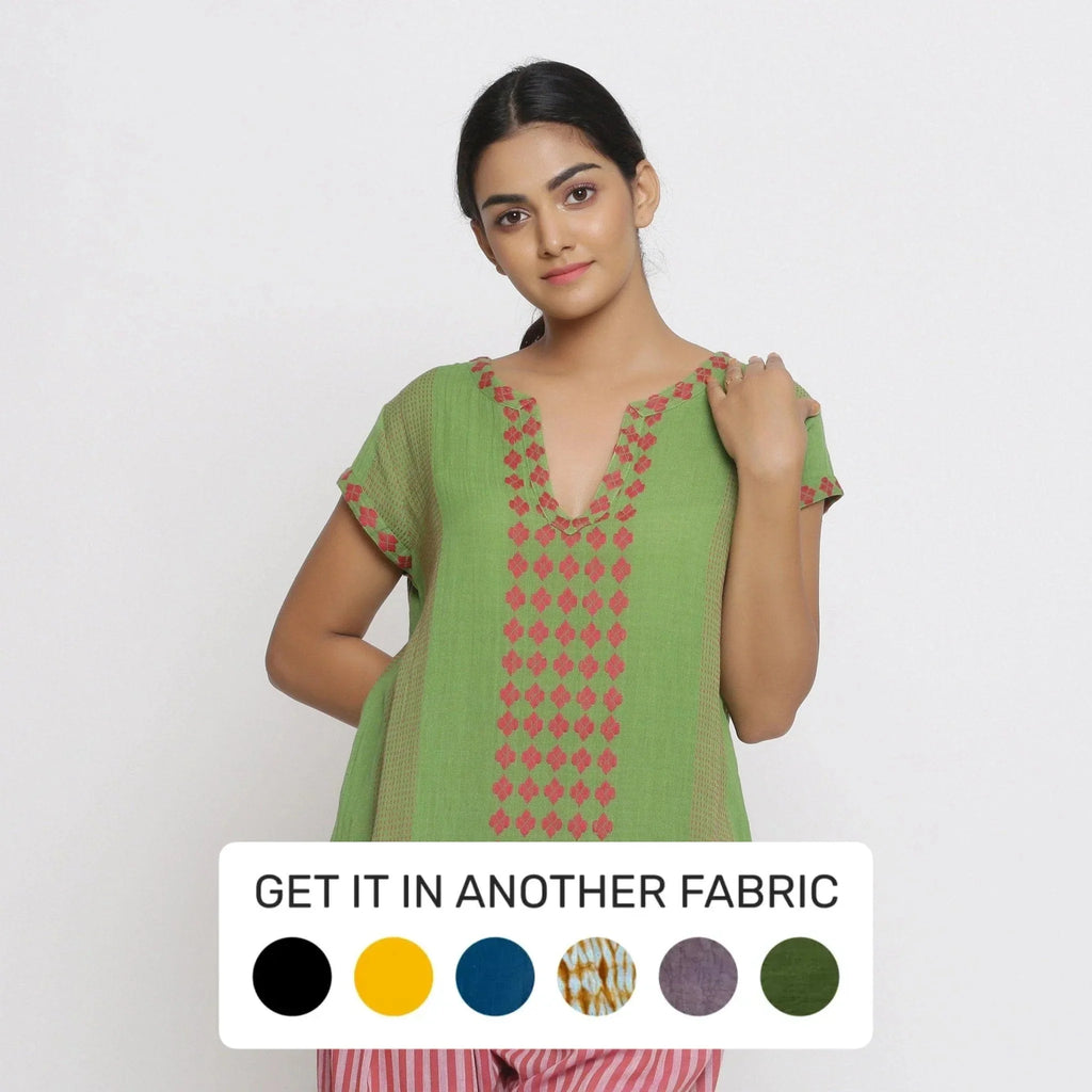 Front View of a Model wearing Green And Red Yarn Dyed A-Line Top