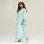 Right View of a Model wearing Green Floral Block Printed Cotton Maxi Kaftan Dress