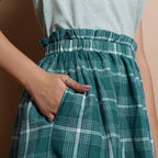 Front Detail of a Model wearing Green Handspun Paperbag Check Skirt