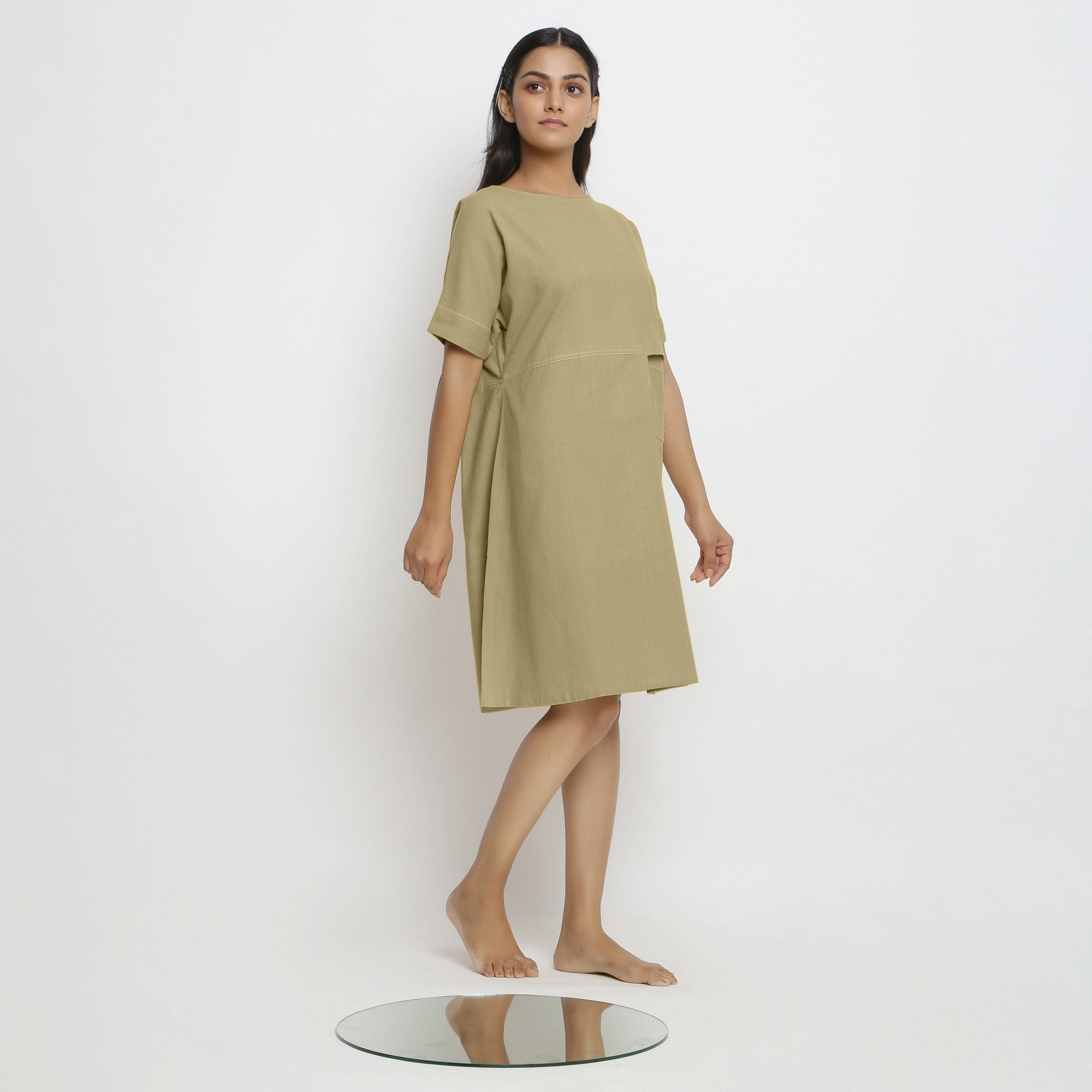 Back View of a Model wearing Green Handspun Vegetable Dyed Yoked Dress