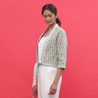 Left View of a Model wearing Green Reversible Block Print Cotton Short Shrug