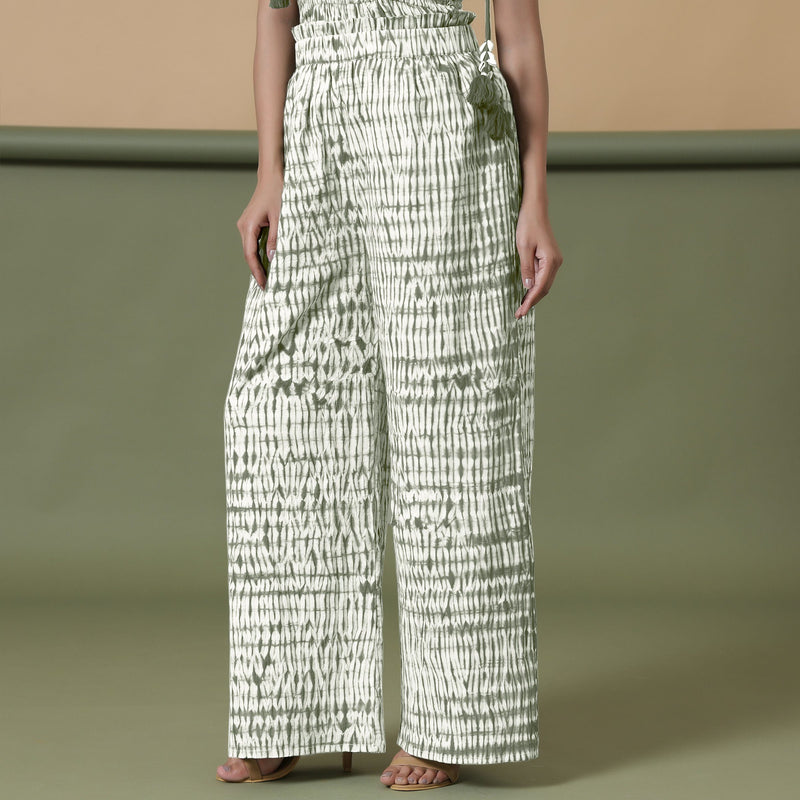 Left View of a Model wearing Green Shibori 100% Cotton Paperbag Pant