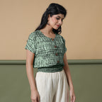 Right View of a Model wearing Green Shibori Tie-Dyed 100% Cotton Top