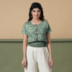 Front View of a Model wearing Green Shibori Tie-Dyed 100% Cotton Top