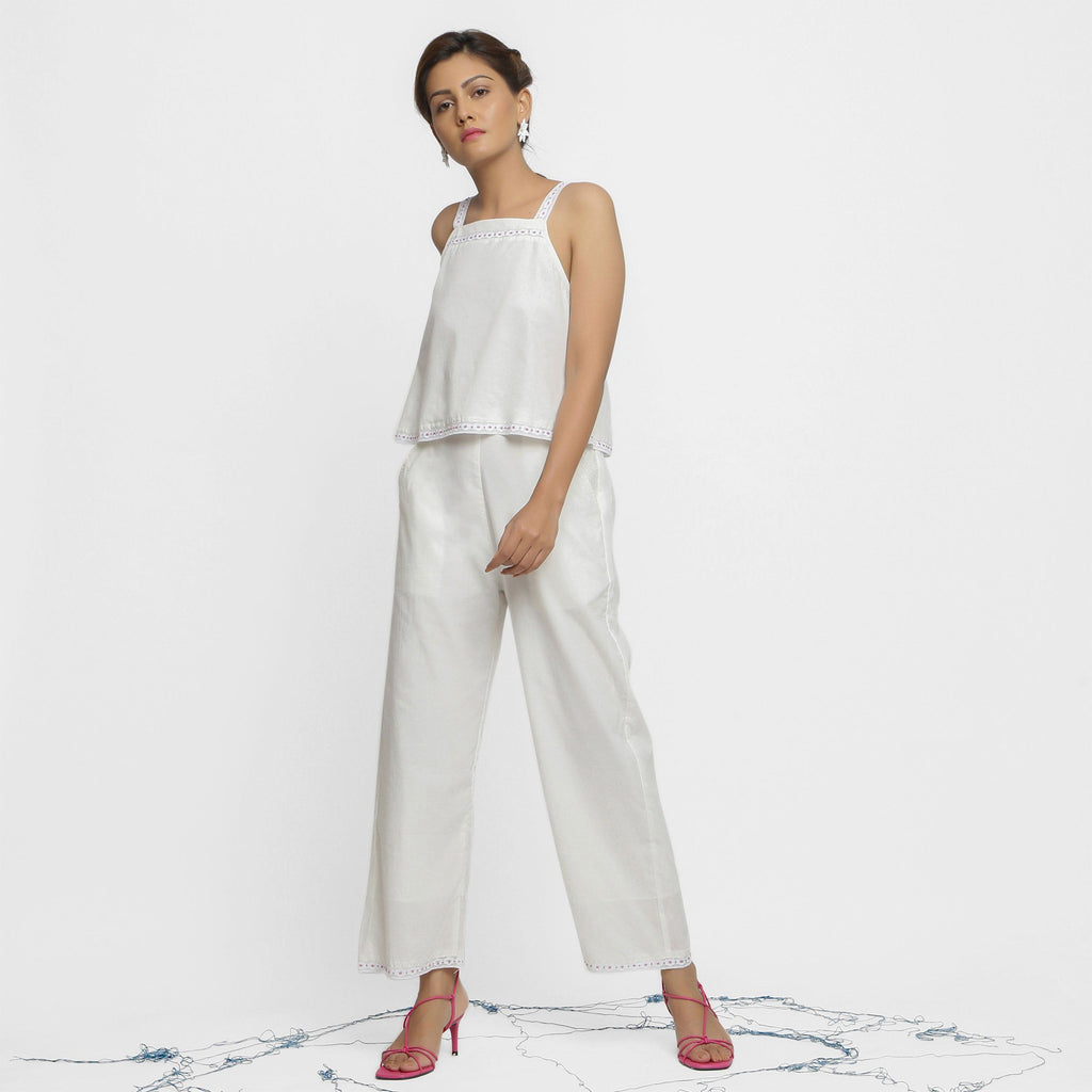 Left View of a Model wearing Hand Beaded Organic Cotton Camisole Top